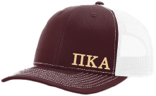 Maroon and white cap with 'ΠΚΑ' logo on a plain background