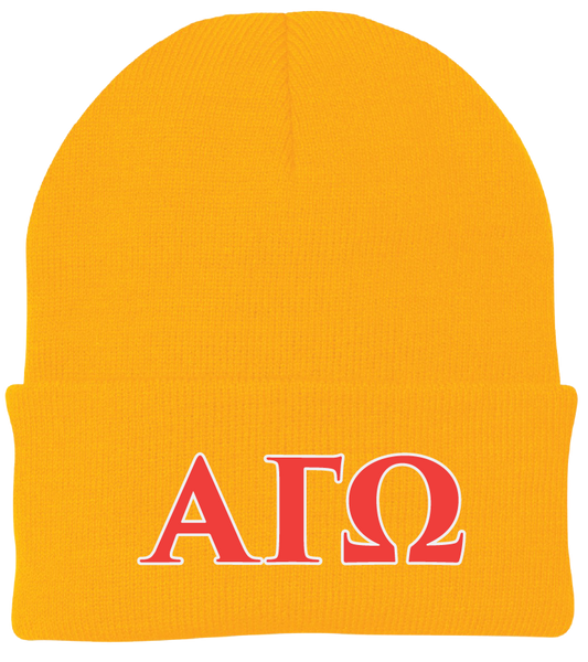 Yellow beanie with red letters 'ΑΓΩ' on a white background