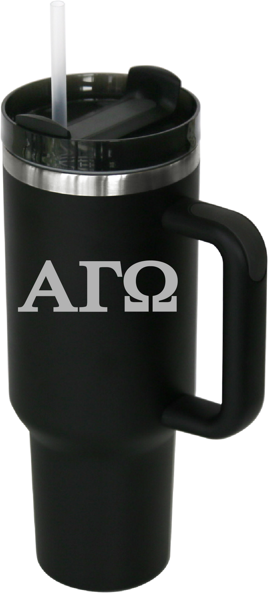 Black travel mug with handle and straw featuring 'ΑΓΩ' text on a white background