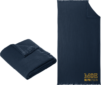 Navy blue textured blanket with 'Alpha Gamma Omega' logo on a white background