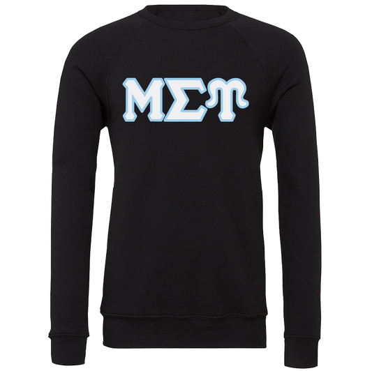 A black long-sleeve crewneck sweatshirt featuring the Greek letters 'ΜΣΤ' in a light blue and white stylized font across the chest, displayed on a clean white background.