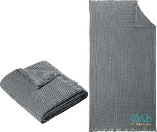 Gray textured blanket with Alpha Delta Pi logo on a white background