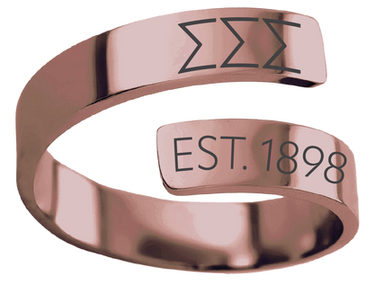 A polished rose gold open band ring engraved with the Sigma Sigma Alpha Greek letter sigma sigma sigma and 'EST. 1898' on a white background.