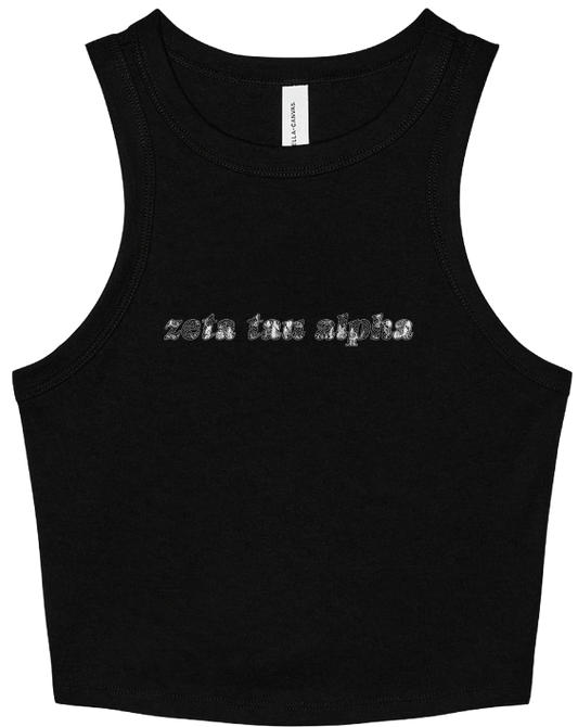 A black sleeveless crop tank top with 'zeta tau alpha' printed across the chest in a textured silver font, shown flat against a white background.